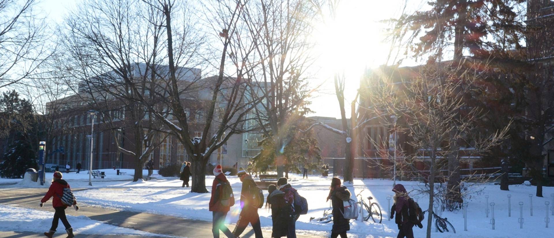 Students walking on campus in winter.